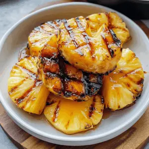 Sweet and smoky, this easy grilled pineapple with caramelized brown sugar will take your summer BBQ to the next level! Perfectly juicy and flavorful, this dessert is a crowd-pleaser for cookouts or gatherings. Save this recipe for a refreshing treat that'll impress your guests and satisfy your sweet tooth! 🍍✨