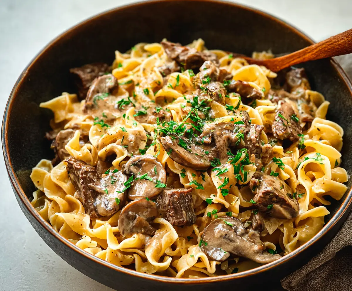 Creamy Beef Stroganoff served over tender noodles, perfect for a hearty meal.