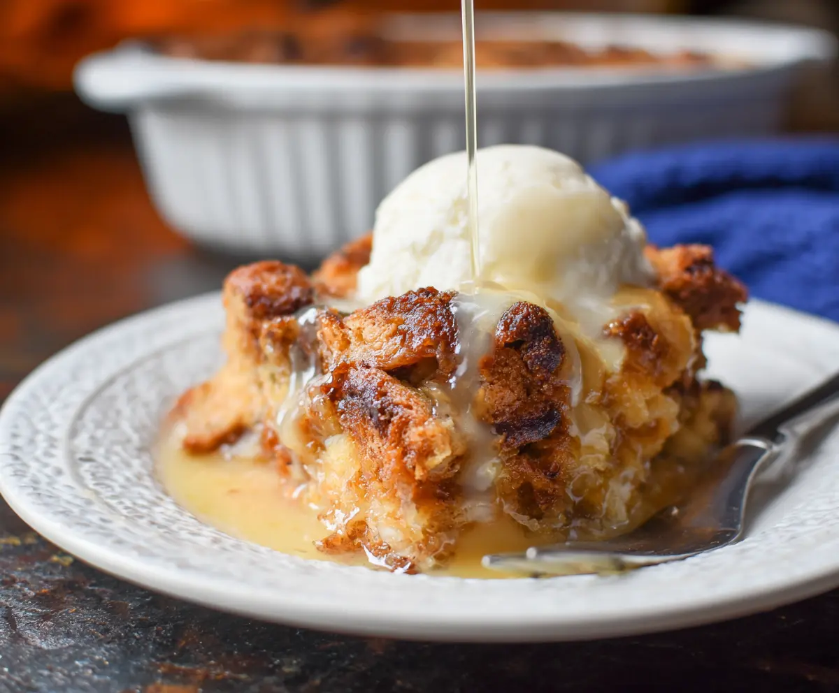 Delicious homemade sourdough bread pudding with a golden crust and creamy interior.