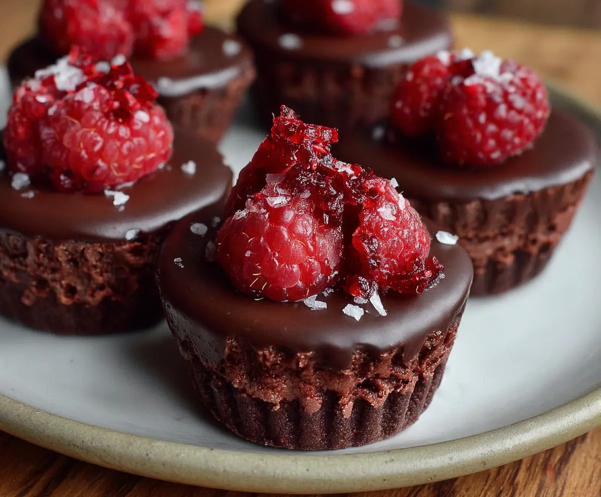 Delicious Marry Me Raspberry Chocolate Mousse Cups with fresh raspberries and rich chocolate topping