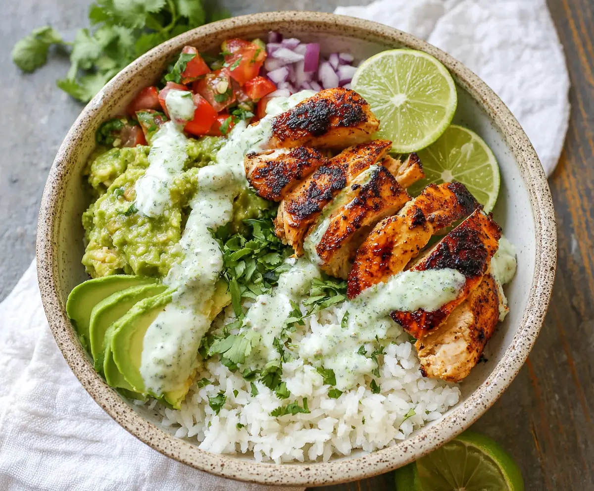 Fresh cilantro lime chicken bowls with colorful vegetables and rice, perfect for a healthy meal.